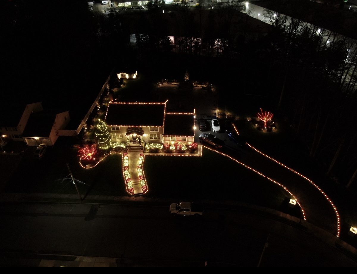 Drone view of a fully lit holiday home