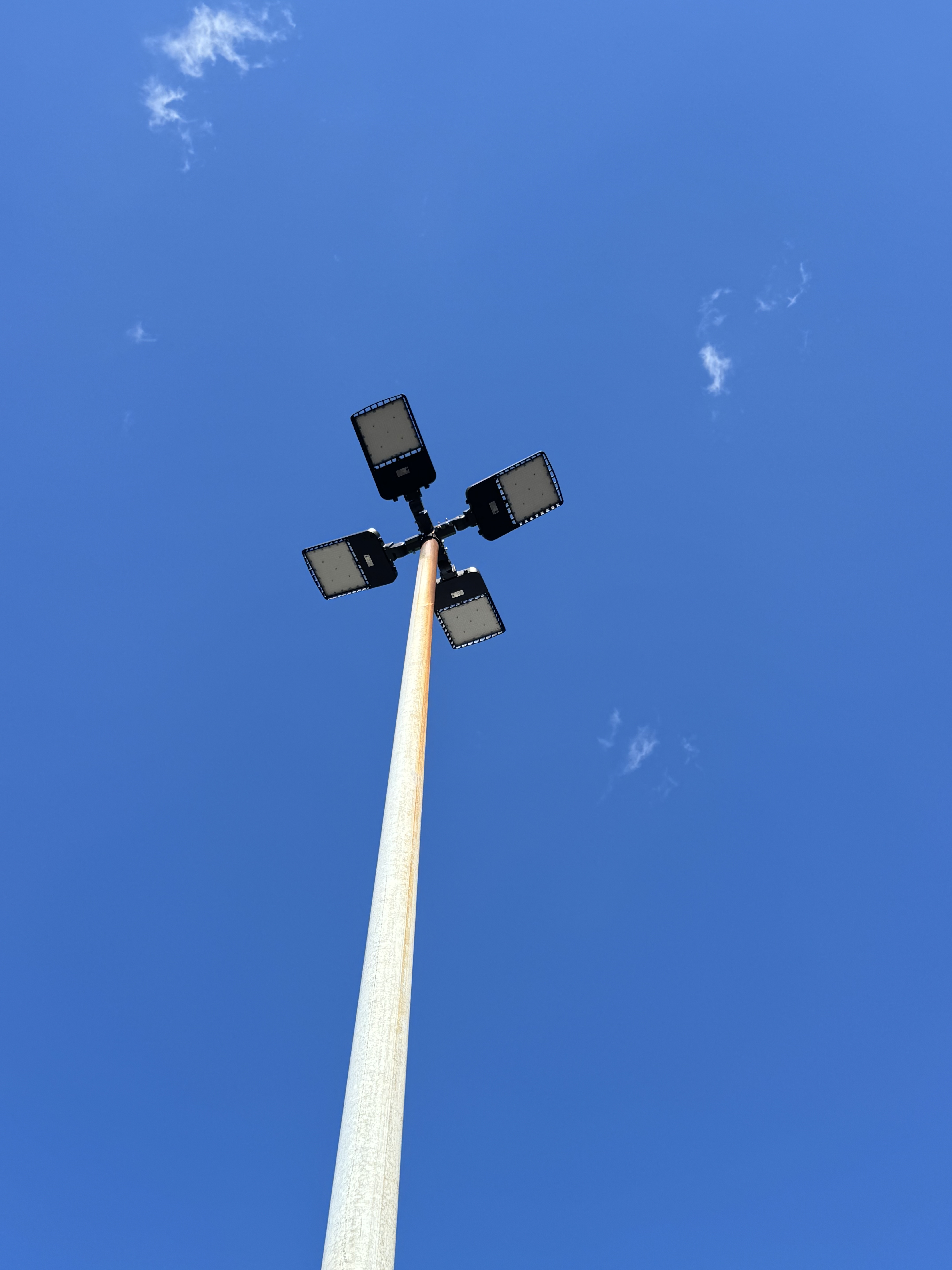 LED parking lot pole top with quad-head fixture