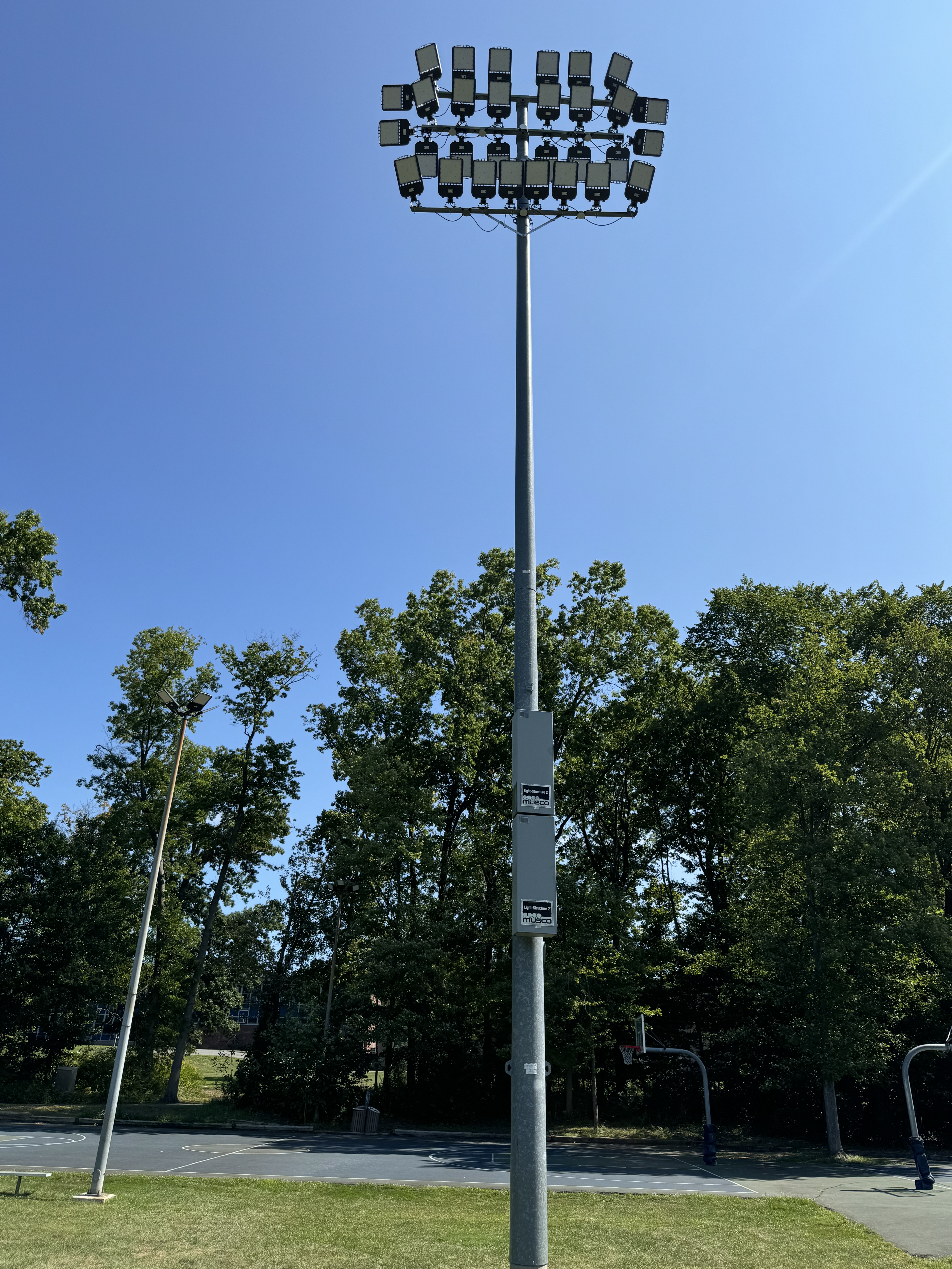 Sports field LED array on tall pole, daytime