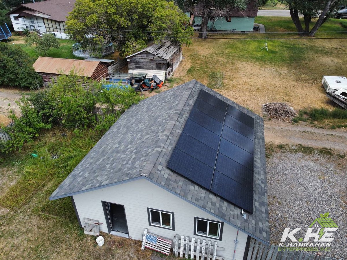 Drone view of small ranch with solar array